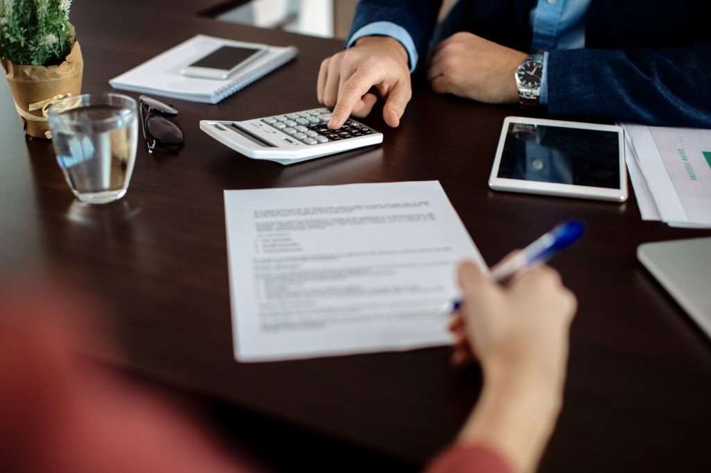 Term Life Insurance Vs Whole close up of insurance agent calculating costs an agreement while having a meeting with a client 1024x682 - Term Life Insurance Vs Whole