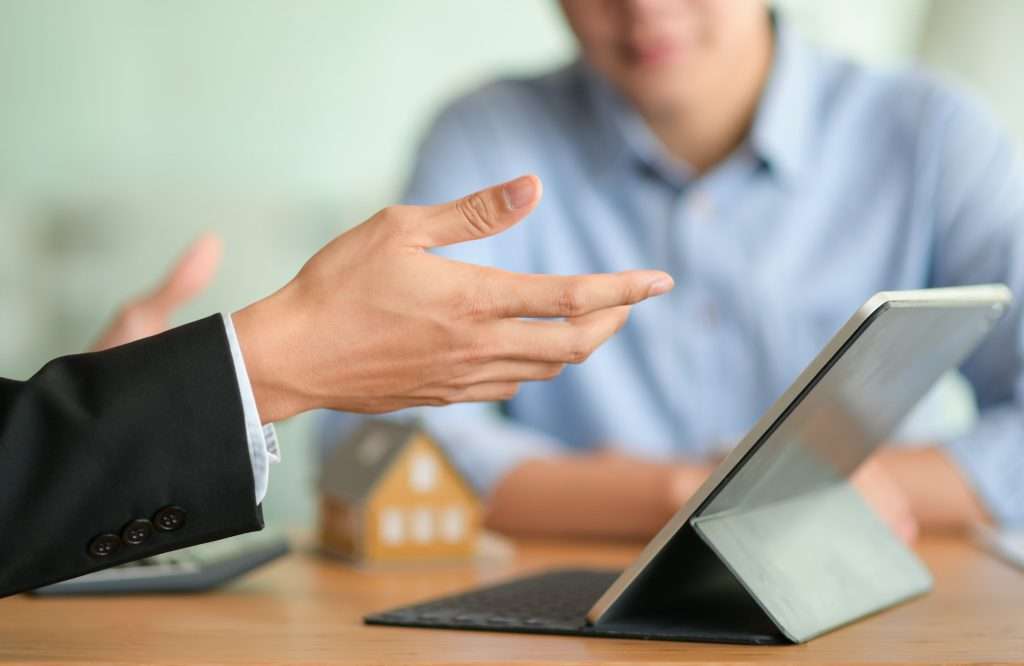 Short-Term Health Insurance Texas close up shot of insurance broker is introducing a health insurance program with his tablet 1024x666 - Short-Term Health Insurance Texas