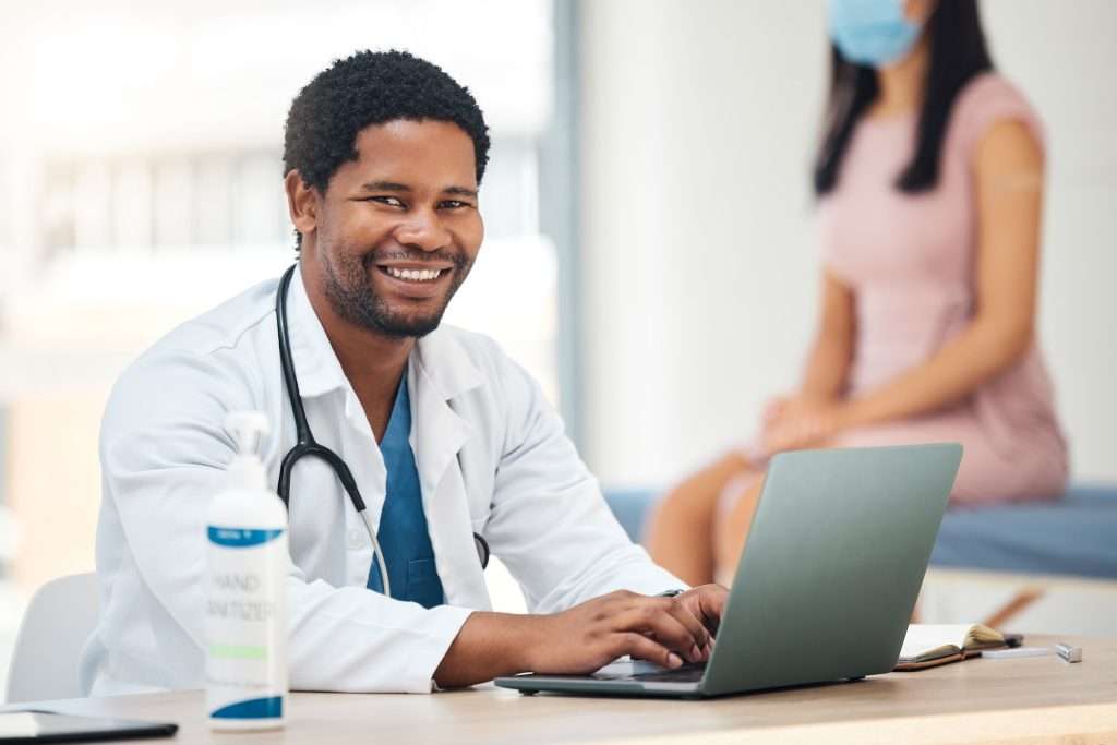 Health Insurance Cheapest doctor laptop and smile for healthcare appointment checkup or research for insurance or policy at 1024x683 - Health Insurance Cheapest