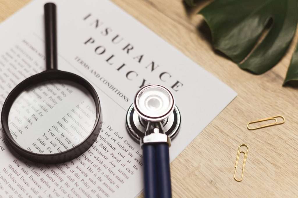 What Is An Insurance Policy Number doctor s stethoscope medical record and health insurance document concept of healthcare 1024x682 - What Is An Insurance Policy Number
