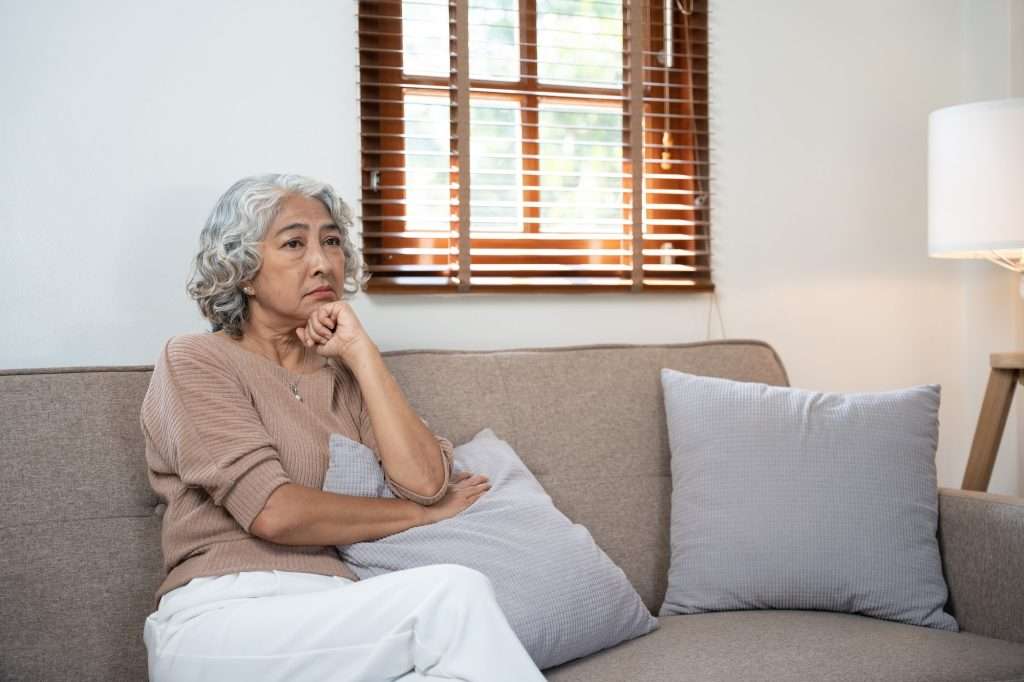 What Is A Beneficiary For Life Insurance elderly asian woman sitting stressed on the sofa life insurance concept 1024x682 - What Is A Beneficiary For Life Insurance