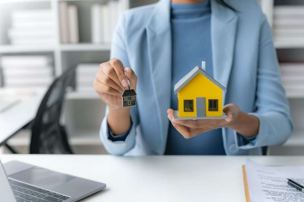 female employee offering homes to client with contract and insurance  1024x682 - Insurance For Property