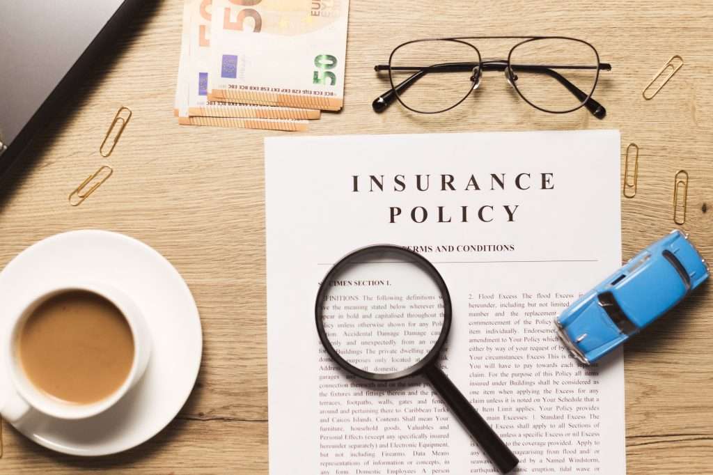 Public Liability Insurance flat lay of vehicle insurance policy magnifier retro car toy and cash 1024x682 - Public Liability Insurance