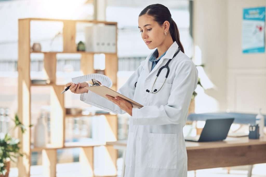 United Health Insurance insurance healthcare and medicine with a doctor reading paperwork in a clipboard in her office in 1024x683 - United Health Insurance