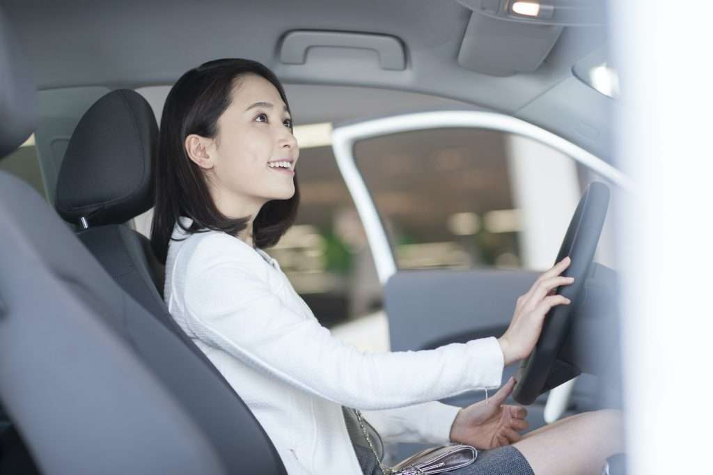 Cheap Car Insurance For New Drivers young woman choosing car in showroom 1024x682 - Cheap Car Insurance For New Drivers